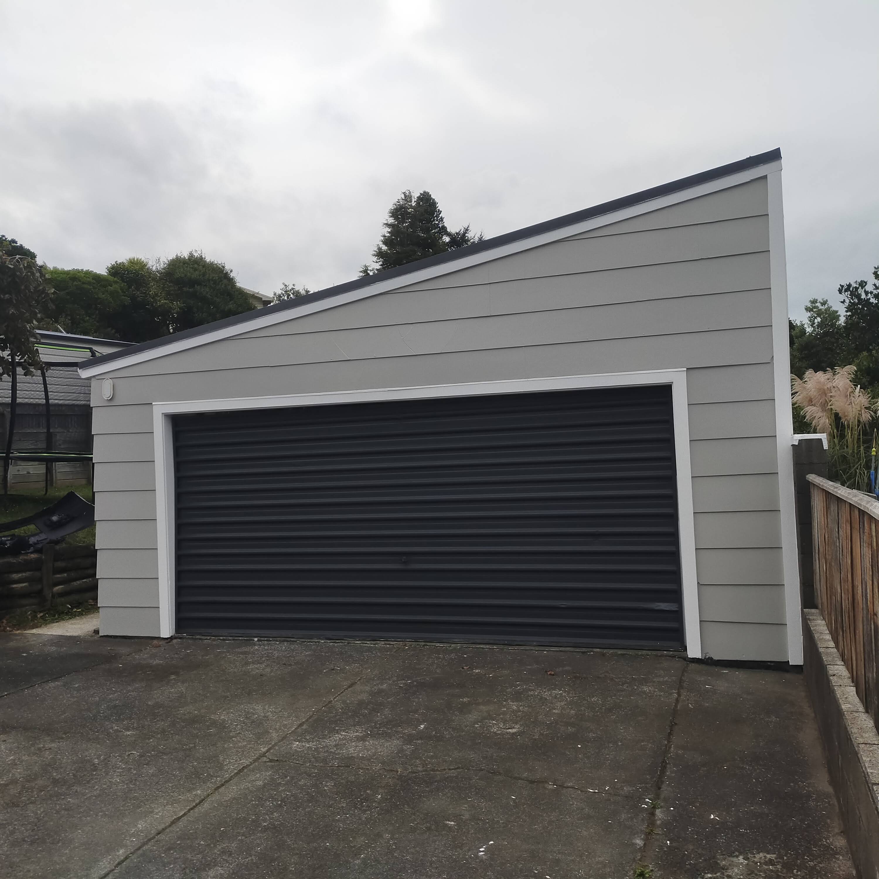 Grey weatherboard home and garage - clean exterior repaint